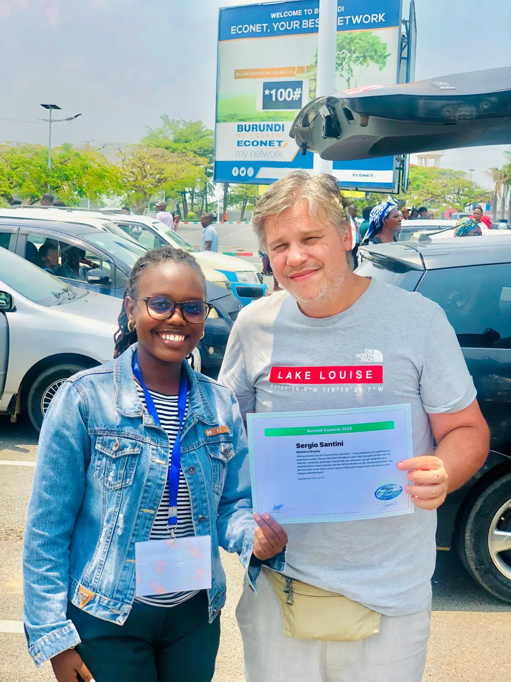 M Travel and Tours Burundi representative welcoming an airport guest